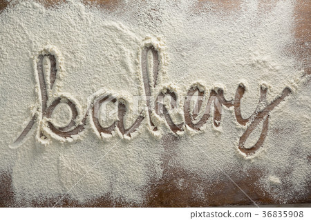 The word bakery written on sprinkled flour 36835908