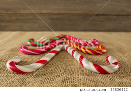 Multicolored candy canes arranged on fabric Multicolored candy canes arranged on fabric 36836112