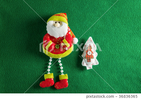 Handmade christmas decorations on green background Handmade christmas decorations on green background 36836365