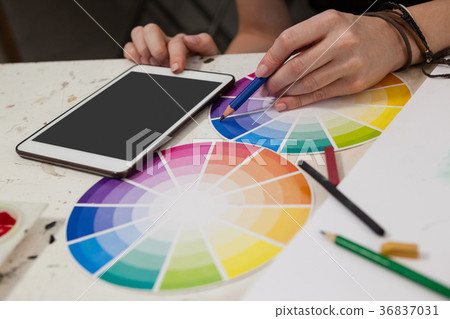 Close-up of woman matching color with color swatch Close-up of woman matching color with color swatch 36837031