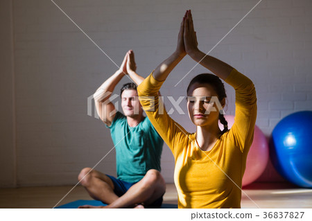 People meditating in prayer position at club People meditating in prayer position at club 36837827