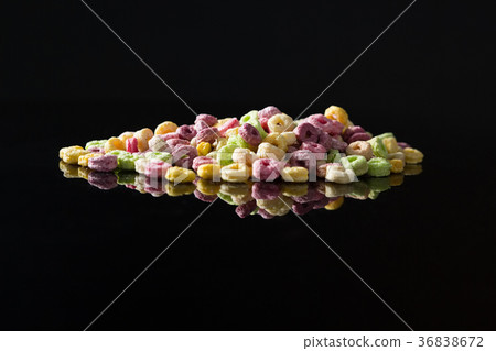 Froot loops on black background 36838672