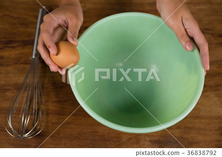Woman holding a brown egg Woman holding a brown egg 36838792