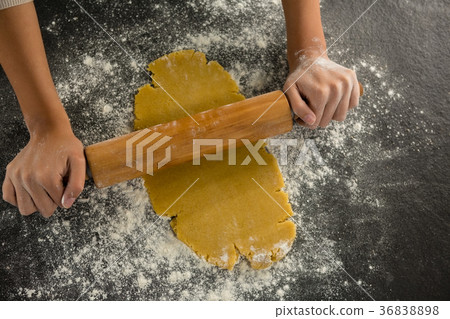 Hand baking dough with rolling pin 36838898