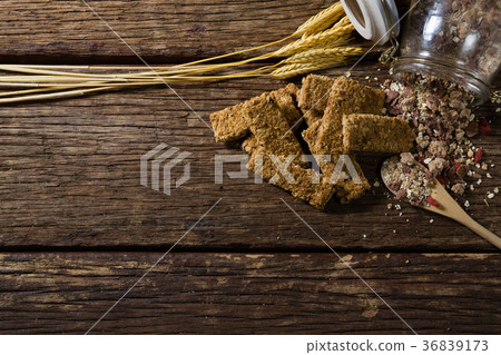 Granola bars and breakfast cereals spilling out of bottle Granola bars and breakfast cereals spilling out of bottle 36839173