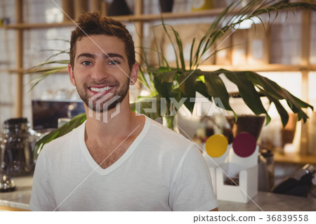 Portrait of man standing at cafe Portrait of man standing at cafe 36839558