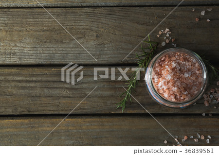 Himalayan salt and rosemary on wooden table Himalayan salt and rosemary on wooden table 36839561