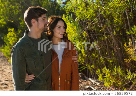 Couple standing by trees 36839572