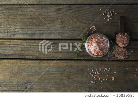 Himalayan salt and rosemary on wooden table Himalayan salt and rosemary on wooden table 36839585