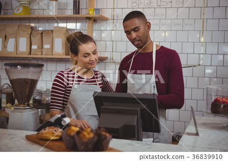 Owners working in cafe 36839910