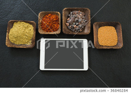 Various spices in bowl with digital tablet Various spices in bowl with digital tablet 36840284