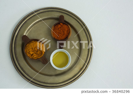 Spices powder with oil in bowl Spices powder with oil in bowl 36840296