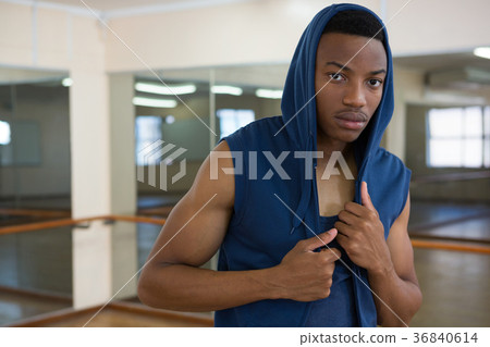 Portrait of male dancer in hooded shirt 36840614