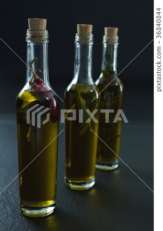 Bottles of olive oil with herbs Bottles of olive oil with herbs 36840844