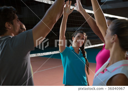 Volleyball players giving high-five to each other 36840967