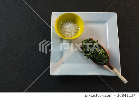 Herb in a scoop with salt Herb in a scoop with salt 36841134