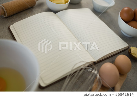 Close up of ingredients amidst open book Close up of ingredients amidst open book 36841614