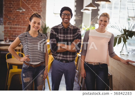 Smiling young friends at coffee shop Smiling young friends at coffee shop 36842283