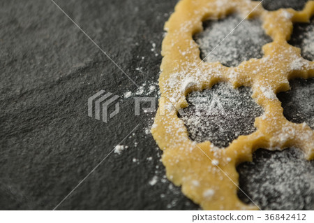 High angle view of flower shape on dough High angle view of flower shape on dough 36842412