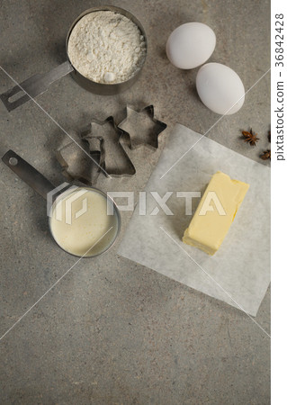 High angle view of butter on wax paper by ingredients 36842428