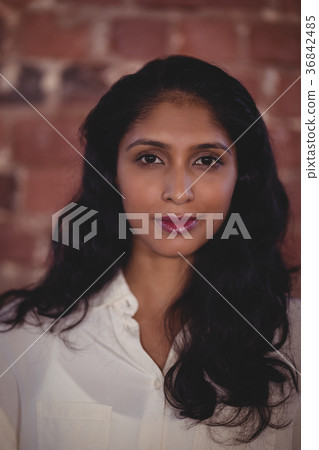 Close up portrait of confident young female professional Close up portrait of confident young female professional 36842485