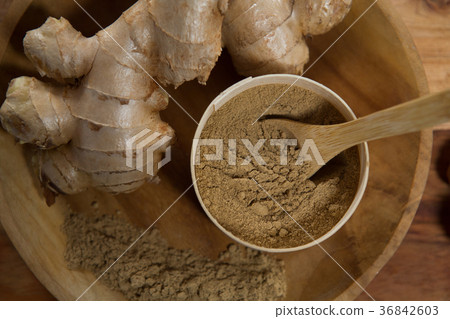 Overhead view of ginger with powder in plate 36842603