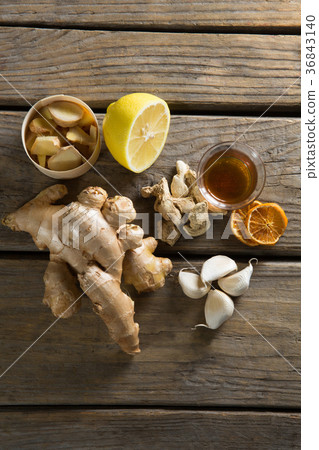 Tea with lemon and ginger on table Tea with lemon and ginger on table 36843140