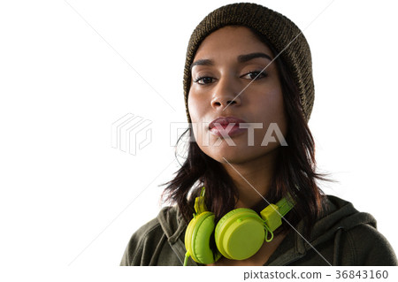 Portrait of confident young woman with headphones Portrait of confident young woman with headphones 36843160