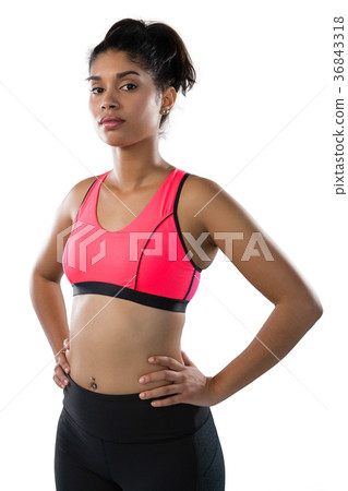 Confident young female athlete against white background Confident young female athlete against white background 36843318