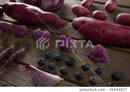 Various vegetable arranged on wooden table 36844037