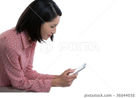 Female executive using mobile phone Female executive using mobile phone 36844038