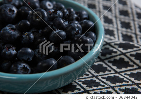 Blueberries in bowl on a textile Blueberries in bowl on a textile 36844042