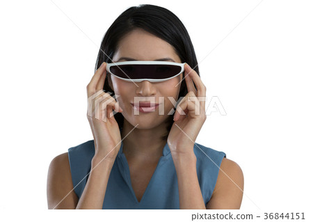 Female executive using virtual reality headset 36844151