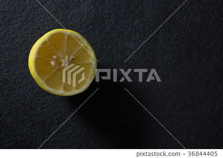 Halved lemon on black background 36844405