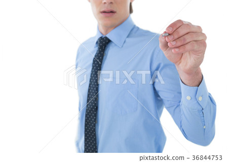 Mid section of businessman writing on imaginary screen 36844753