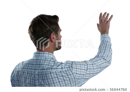 Man pretending to touch an invisible screen 36844760