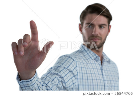 Man pretending to touch an invisible screen Man pretending to touch an invisible screen 36844766