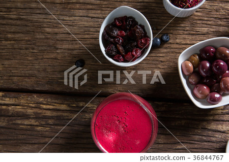 Fruits and juice on wooden table Fruits and juice on wooden table 36844767