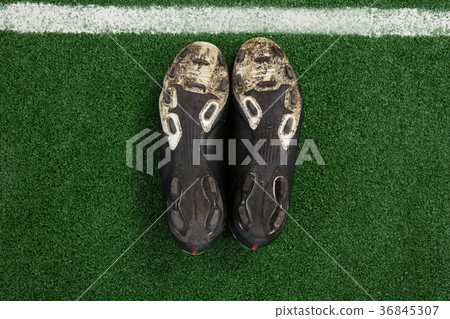 Cleats kept upside down on artificial grass Cleats kept upside down on artificial grass 36845307