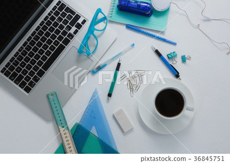 Laptop, black coffee and stationery on white background Laptop, black coffee and stationery on white background 36845751