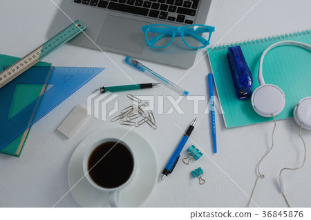 Laptop, black coffee and stationery on white background Laptop, black coffee and stationery on white background 36845876