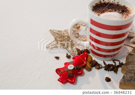Coffee with cinnamon powder and christmas decorations 36846231