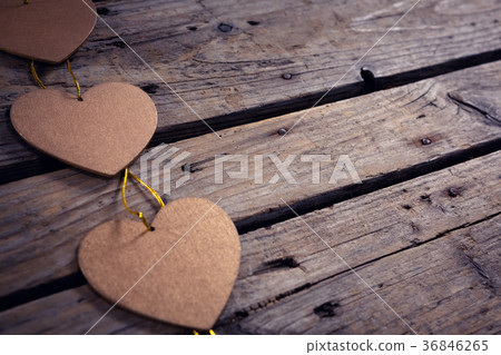 Heart shaped christmas decoration on wooden plank 36846265