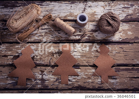 Crafts material and handmade christmas tree on wooden plank Crafts material and handmade christmas tree on wooden plank 36846501