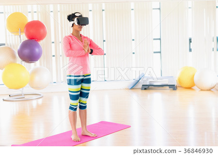 Woman performing while using virtual reality headset 36846930