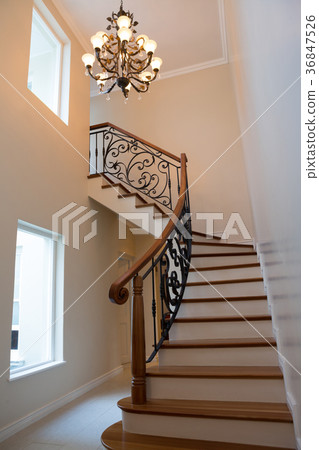 Staircase and chandelier at home 36847526