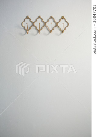 Hook attached on wall 36847703