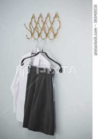 Formal shirt and skirt hanging on hook Formal shirt and skirt hanging on hook 36848016