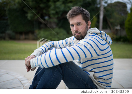 Man standing in the park Man standing in the park 36848209