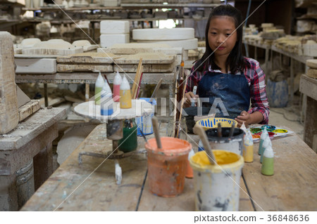 Portrait of girl painting bowl Portrait of girl painting bowl 36848636